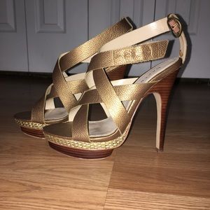 Gold/Bronze platform high heels with ankle straps. Shoe name is Kimberly.